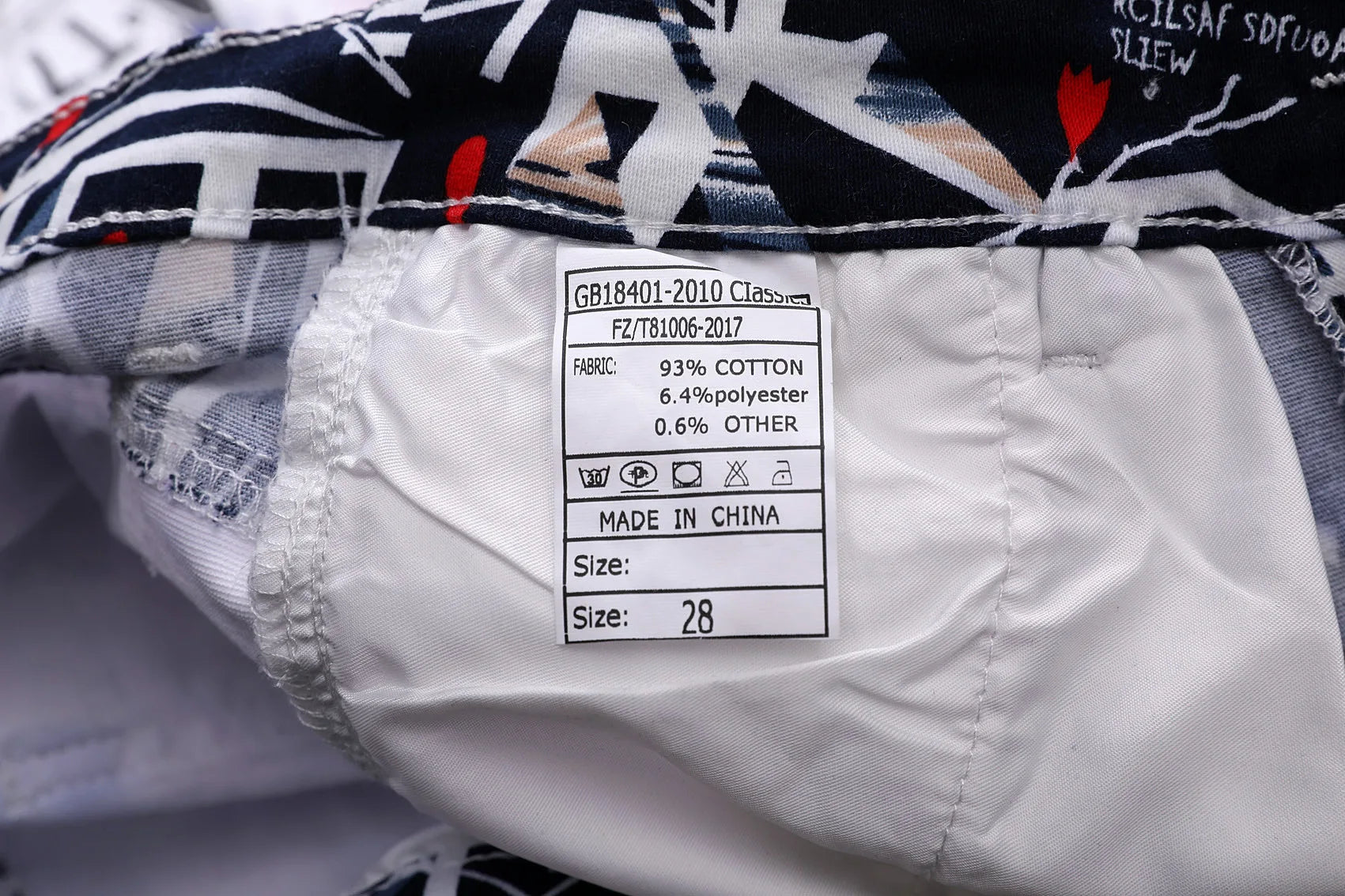 Clothing label with size and material information on a garment