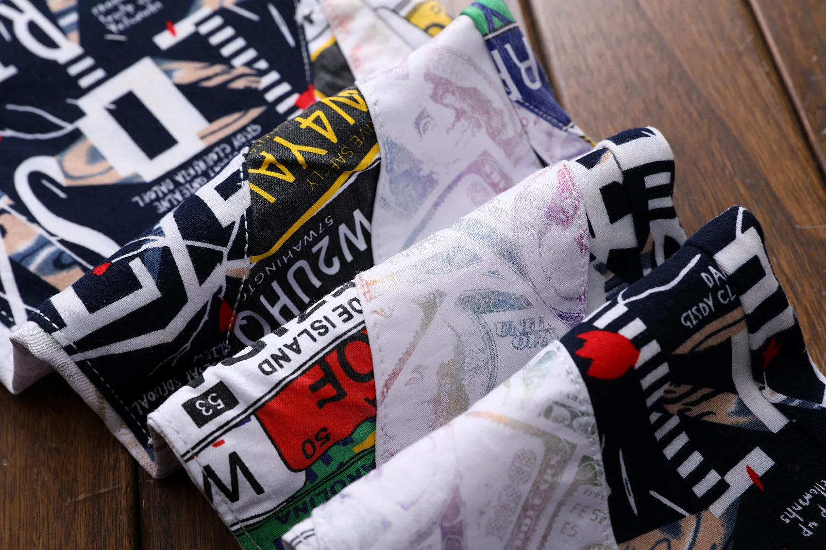 Collection of patterned fabric swatches on a wooden surface